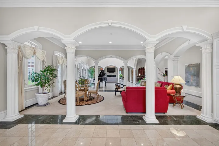 Living area framed by columns and arches